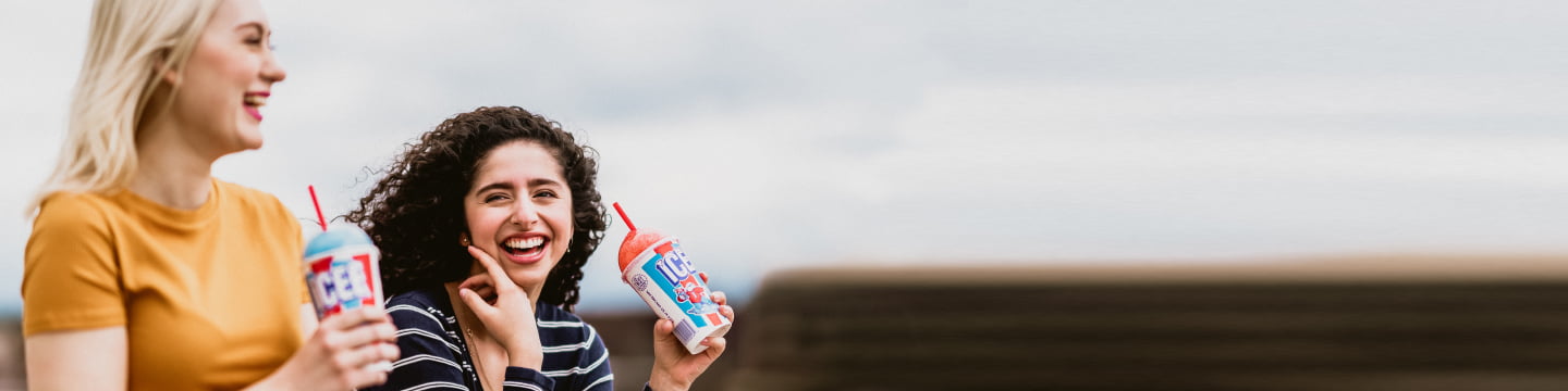 Two friends drinking ICEE's